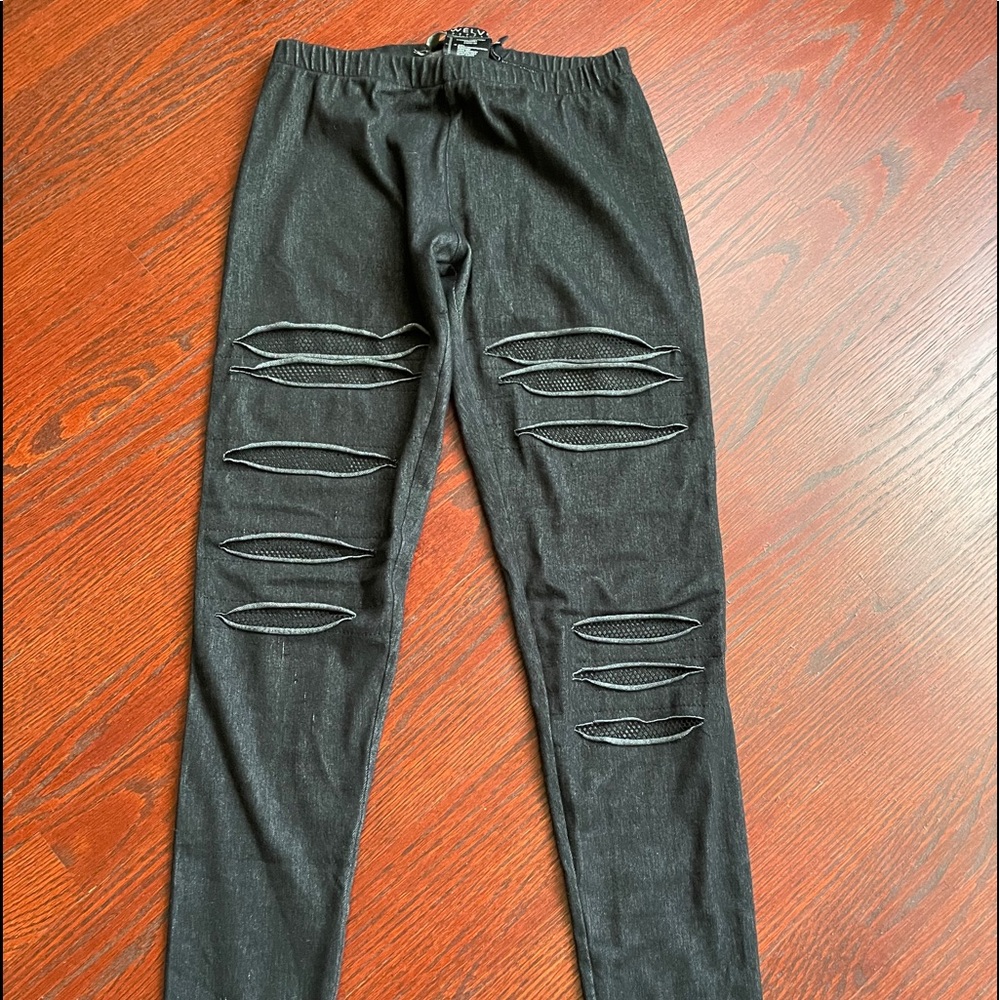 Twelve leggings with mesh cutouts size S